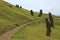 Walking route among the legendary giant Moai statues at Rano Raraku volcano on Easter Island, Chile