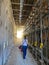 Walking through a scaffolding tunnel in the from earthquake destroyed town of L\\\'Aquila, Italy