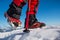 Walking on snow with Snow shoes and Shoe spikes in winter.