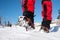 Walking on snow with Snow shoes and Shoe spikes in winter.