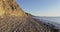 Walking on stones beach and quiet sea