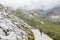 Walking summer trekking in the Dolomites. People in the mountains. Mountain view Italian Alps.