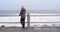 Walking, thinking and woman on promenade by ocean with sadness for memories, nostalgia and reflection. Depression