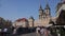 Walking thru international tourist crowd on Prague Old Town Square