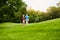 Walking to our favourite spot on the course. a mature couple on a golf course.