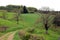 Walking trail in French countryside with beautiful view on green flowering hills, France