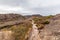 Walking trail among rugged cliffs.