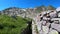 Walking in the trenches of the First World War. POV of the hiker. Impressive view of the ruins. Cadorna front line. Orobie Alps