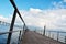 Walking way and Vasco da Gama bridge over Tagus river