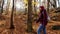 Walking Women in the Autumn Forest, Enjoying the Nature.