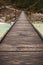 Walking on wooden footbridge crossing over turquoise river of soca, triglav national park, slovenia