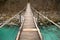 Walking on wooden footbridge crossing over turquoise river of soca, triglav national park, slovenia