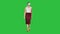 Walking young woman using vr glasses on a Green Screen, Chroma Key.