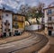 Walks on the way to the yellow Lisbon tram.