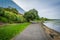 Walkway along the Potomac River and modern office building in Al