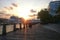 Walkway along the promenade. road covered with wood, pier cruise liner at sunset. Summer cloudy.