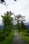 Walkway and benches in Japanese garden on mountaintop with panorama view