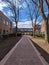 Walkway building campus trees blue sky