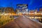 Walkway and buildings along Pratt Street at night, in the Inner Harbor, Baltimore, Maryland