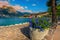 Walkway decorated with flowers on the waterfront, lake Garda, Italy