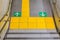 Walkway with direction arrow yellow pavement in Japan subway