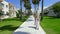 Walkway, houses and palm trees.