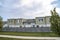 Walkway in the middle of a lawn outside the fenced residential area