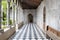 Walkway path with checkered pattern marble tiles floor in old gothic church