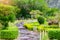 Walkway path in the green lawn garden, landscape of fresh nature