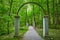 Walkway of roses, Rose Island park, forest, woodland, stone arches, archway, trail ending in woods