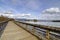 Walkway with wooden rails by the river