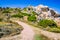 Walky path between bizarre granite rock formations in Capo Testa, Sardinia, Italy