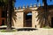 Wall with battlements and large gate in the castle courtyard, Jerez de la Frontera, Spain.