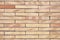 Wall of beige clinker bricks