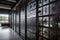 wall of blackened steel and glass with industrial design elements