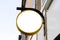 Wall with blank round golden signage empty banner ready for your artwork sign with company name on facade