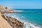 Wall and breakwater in stone cubes next to Santa Maria del Mar beach and Santa Mariadel beach, Cadiz - Spain