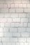 Wall of bricks with incomprehensible divorces. Texture of masonry. Blank background.