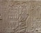 Wall carving of man or priest offering food in Abydos seti temple in Sohag