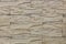 Wall cladding with decorative large brown tiles. Texture, background.