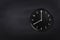 Wall clock showing eight o`clock on black chalkboard background. Office clock showing 8am or 8pm on black texture