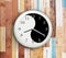 Wall clock with a yin yang symbol