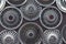 Wall collection of vintage rusty automobile hubcaps of retro cars