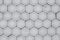 Wall with concrete honeycombs. Concrete gray hexagonal tiles, honeycomb tiles texture background