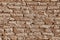 Wall consisting of coarse bricks from clay, sandstone, or lime.