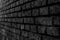 Wall Constructed from Hand Made Clay Bricks in Black and White