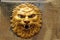 Wall decoration, a lion`s head made of ceramics