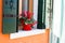 Wall with flowers on the windowsill in decorative flowerpots and other decorations