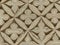 Wall with four-leaf clovers forms of the mausoleum of Ismail Samani to Bukhara in Uzbekistan.