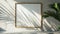 Wall frame sits empty, partially draped in shadows cast by a nearby palm tree\\\'s foliage.